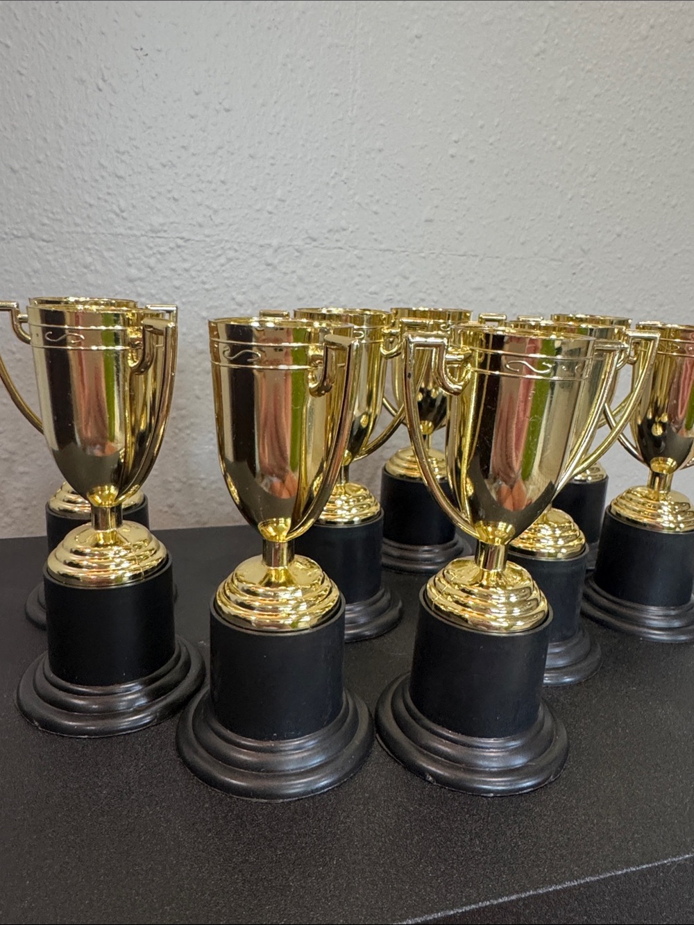 Set of Small Gold Cup Trophies with Black Bases